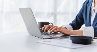 Young,Asian,Business,Woman,Working,With,Laptop,Computer,At,Workspace,